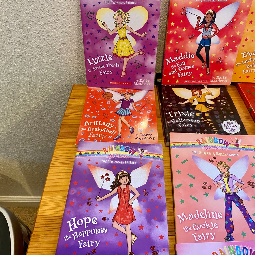 SOLD 11 Scholastic Rainbow Magic Series books.